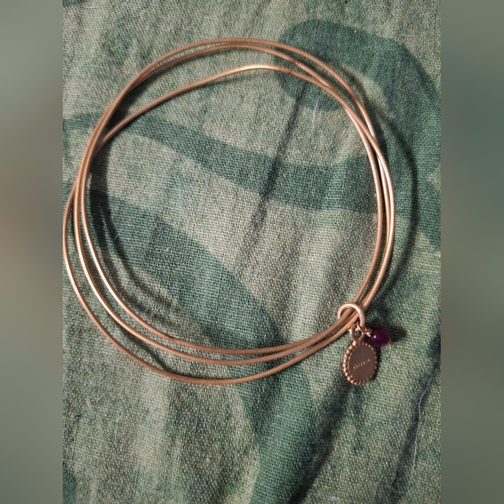Elegant Gold Bangle Bracelet with Charm